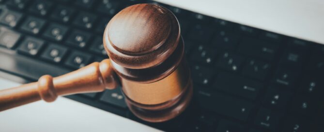 a wooden gaven sitting on top of a computer keyboard